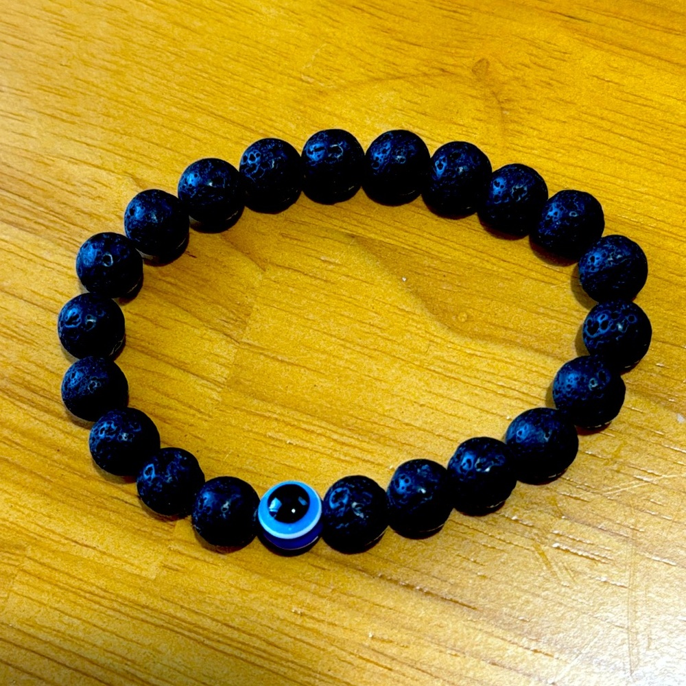 Lava stones and evil eye, 6.5” stretch bracelet.